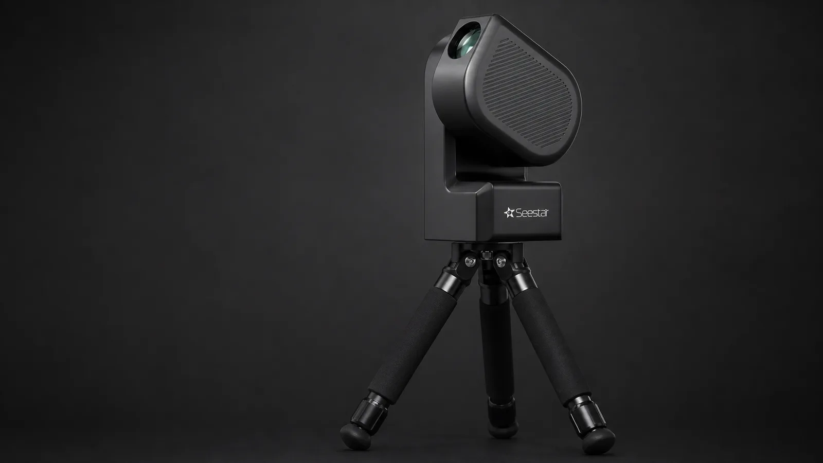 Studio product shot of the ZWO Seestar S50 showing its black tear-drop body, integrated lens at the top corner, and compact tripod